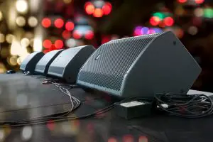 speakers attached to a stage